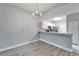 Dining area with chandelier and wood-look floors at 1032 Radison Ave # 2, Sun City Center, FL 33573