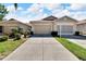 Two-story house with a two-car garage and well-maintained landscaping at 1032 Radison Ave # 2, Sun City Center, FL 33573