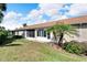 Rear view of the house showcasing a screened patio at 1032 Radison Ave # 2, Sun City Center, FL 33573