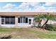 Rear view of the house showing a screened patio and Florida room at 1032 Radison Ave # 2, Sun City Center, FL 33573