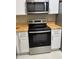 Stainless steel appliances and light wood countertops in this kitchen at 1032 Radison Ave # 2, Sun City Center, FL 33573