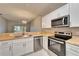 Modern kitchen with butcher block countertops and stainless steel appliances at 1032 Radison Ave # 2, Sun City Center, FL 33573