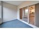 Sunroom with sliding glass doors and blue carpet at 1032 Radison Ave # 2, Sun City Center, FL 33573