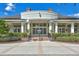 Grand Hampton clubhouse entrance with brick and columns at 7938 Hampton Lake Dr, Tampa, FL 33647