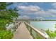 Wooden dock on a calm lake, offering scenic views of the waterfront community at 3753 Lake Bayshore Dr # H305, Bradenton, FL 34205