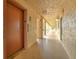 Building hallway with elevator access and doors to units at 3753 Lake Bayshore Dr # H305, Bradenton, FL 34205