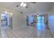 Open living area with tile and wood flooring, and access to other rooms at 3753 Lake Bayshore Dr # H305, Bradenton, FL 34205