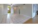 Bright living room with tile flooring and access to kitchen at 3753 Lake Bayshore Dr # H305, Bradenton, FL 34205