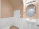 Clean bathroom with pedestal sink and white fixtures at 37658 Aaralyn Rd, Zephyrhills, FL 33542