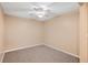 Empty bedroom with ceiling fan and neutral walls at 37658 Aaralyn Rd, Zephyrhills, FL 33542