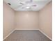 Empty bedroom with ceiling fan and neutral walls at 37658 Aaralyn Rd, Zephyrhills, FL 33542