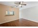 Dining area with wood floors, pass-through to kitchen, and adjacent to a patio at 37658 Aaralyn Rd, Zephyrhills, FL 33542