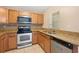 Kitchen with granite countertops, stainless steel dishwasher at 37658 Aaralyn Rd, Zephyrhills, FL 33542