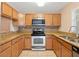 Modern kitchen with stainless steel appliances and granite countertops at 37658 Aaralyn Rd, Zephyrhills, FL 33542