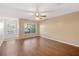 Living room with wood-look floors and a view of the front entry at 37658 Aaralyn Rd, Zephyrhills, FL 33542