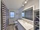 Clean bathroom featuring a large vanity and shower at 909 Birdie Way, Apollo Beach, FL 33572
