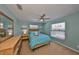 Guest bedroom with a queen-size bed and dresser at 909 Birdie Way, Apollo Beach, FL 33572