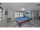 Game room featuring a pool table and hardwood floors at 909 Birdie Way, Apollo Beach, FL 33572