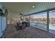 Relaxing patio with seating area overlooking the pool at 909 Birdie Way, Apollo Beach, FL 33572