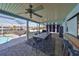 Outdoor dining area on the patio with pool view at 909 Birdie Way, Apollo Beach, FL 33572