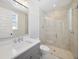 Bathroom featuring a glass shower and a white vanity with chrome hardware at 4010 W Watrous Ave, Tampa, FL 33629
