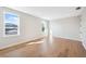 Bright bedroom featuring hardwood floors, white walls and two windows allowing natural light at 4010 W Watrous Ave, Tampa, FL 33629