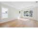 Bright bedroom with hardwood floors, tray ceiling and three windows at 4010 W Watrous Ave, Tampa, FL 33629