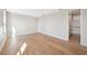 Empty bedroom featuring hardwood floors, white walls and a large window at 4010 W Watrous Ave, Tampa, FL 33629