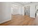 Open dining room with hardwood floors, modern lighting, and glass-paned doors at 4010 W Watrous Ave, Tampa, FL 33629