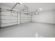 Spacious three car garage with epoxy flooring and ample storage at 4010 W Watrous Ave, Tampa, FL 33629