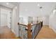 Second story hallway with hardwood floors and staircase railing at 4010 W Watrous Ave, Tampa, FL 33629