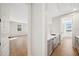 Hallway with white cabinets, a stainless steel sink and light gray countertops at 4010 W Watrous Ave, Tampa, FL 33629