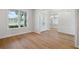 Clean interior space featuring hardwood floors and white walls at 4010 W Watrous Ave, Tampa, FL 33629