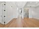 Open floor plan with hardwood floors, white walls, and modern lighting fixtures at 4010 W Watrous Ave, Tampa, FL 33629