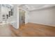 Clean interior space featuring hardwood floors, white walls, and glass-paneled doors at 4010 W Watrous Ave, Tampa, FL 33629