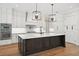 Spacious kitchen with a large center island, modern appliances, and ample counter space at 4010 W Watrous Ave, Tampa, FL 33629
