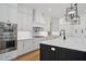 View of the kitchen with modern stainless appliances, white cabinets, and beautiful countertops at 4010 W Watrous Ave, Tampa, FL 33629