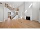 Bright living room with staircase, fireplace, wood floors, and abundant natural light at 4010 W Watrous Ave, Tampa, FL 33629