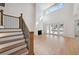 Bright living room with high ceilings, fireplace, hardwood floors and staircase with iron spindles at 4010 W Watrous Ave, Tampa, FL 33629