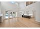 Spacious living room open to kitchen, featuring hardwood floors and plenty of natural light at 4010 W Watrous Ave, Tampa, FL 33629