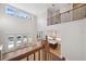 Open-concept living space featuring hardwood floors, a two story wall of windows, and island kitchen at 4010 W Watrous Ave, Tampa, FL 33629
