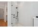 Close up of large walk-in shower featuring decorative tile and modern fixtures at 4010 W Watrous Ave, Tampa, FL 33629