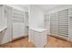 Walk-in closet with custom shelving and built-in storage at 4010 W Watrous Ave, Tampa, FL 33629