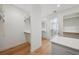 Walk-in closet with custom shelving and an ensuite bathroom at 4010 W Watrous Ave, Tampa, FL 33629