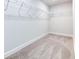 Large walk-in closet with wire shelving and neutral carpet at 16111 69Th E Ln, Parrish, FL 34219