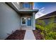 Inviting front entrance with a blue door and landscaped walkway at 16111 69Th E Ln, Parrish, FL 34219