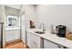 Clean bathroom with white cabinets and quartz countertop at 704 S Newport Ave, Tampa, FL 33606