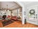 Bright living room with hardwood floors, fireplace and large windows at 704 S Newport Ave, Tampa, FL 33606