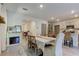 Dining area features a farmhouse table and electric fireplace at 7516 Cypress Walk Dr, New Port Richey, FL 34655