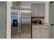 Stainless steel refrigerator with built-in water dispenser and ice maker at 7516 Cypress Walk Dr, New Port Richey, FL 34655